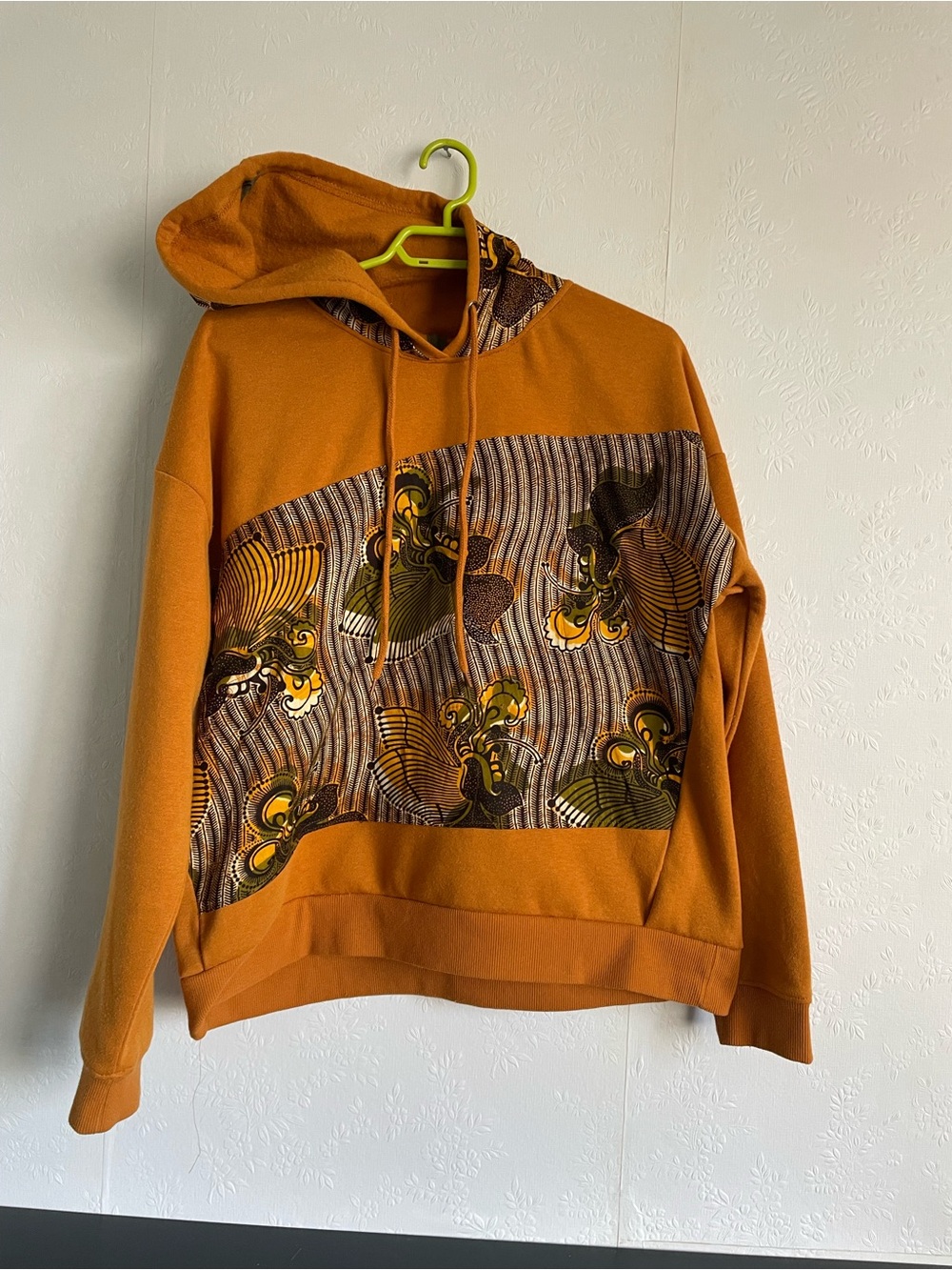 Upcycled Hoodie with Ankara Fabric featuring Rust Orange colors.